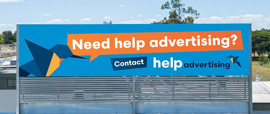 The Help Advertising digital billboard showing a 'Need help advertising?' ad
